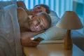 The man with a phone lay near sleeping woman Photo