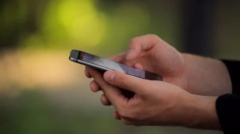 The Man With the Phone in the Park Video stock 50994769