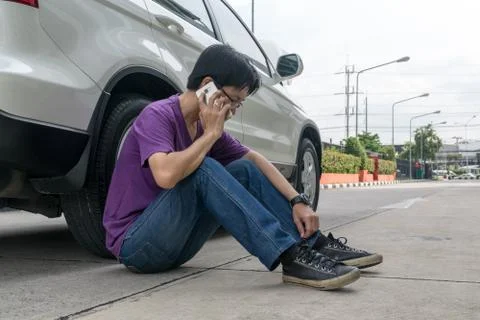 Man Phoning For Help with a broken down car Stock Photos
