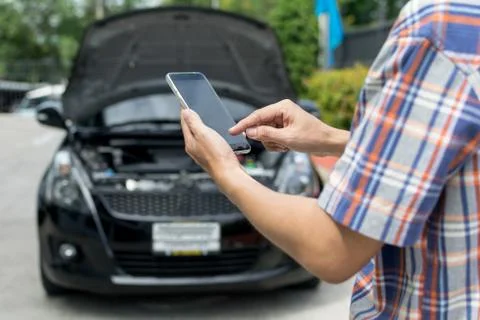 Man Phoning For Help with a broken down car Stock Photos