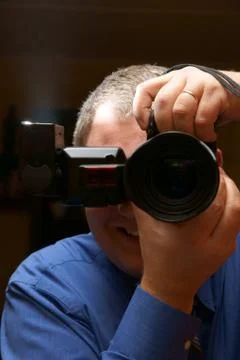 Man, photographer with dslr and flash lamp Stock Photos