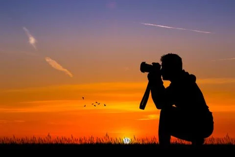 Man photographer at sunset Stock Illustration