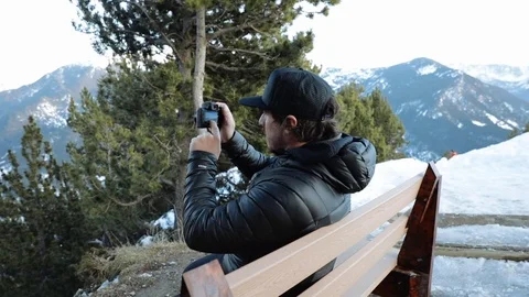Man photographing high mountain Stock Footage 102851692