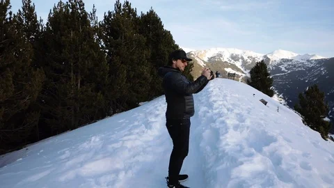 Man photographing high mountain Stock Footage 102851704