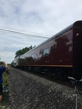 Man photographing a Pullman carriage pulled by Big Boy steam engine Stock Photos