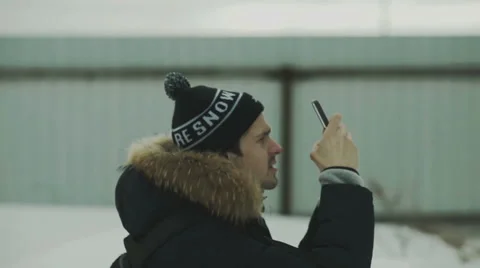 Man photographing something on smartphone Stock Footage 59938605