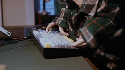 Man with Physical Disability Typing on Keyboard in Evening Light Stockbeeldmateriaal 321938381