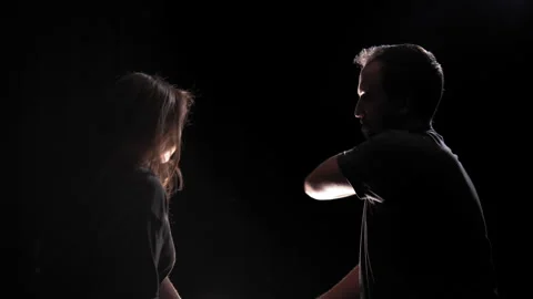 Man physically abuses a woman by hit her with his hand, after that she hitting Stock Footage 312809705