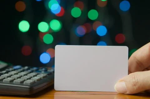 Man pick empty card have colorful bokeh as background Stock Photos