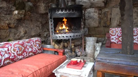 Man Pick Up A Woolen Cup Of Coffee Near A Fireplace. Stock Footage 105886483