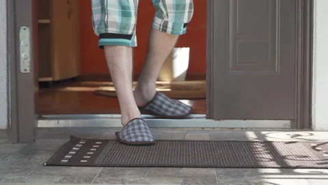 The man picked up the delivery from the doorstep. Stock-Footage 322118768