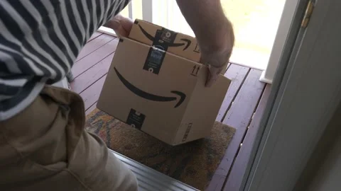 Man Picking up Amazon Prime Packages Left at His Front Door Stock Footage 133195662