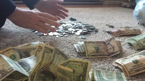 Man Picking Up and Dropping Coins in Slow Motion 스톡 동영상 104464826