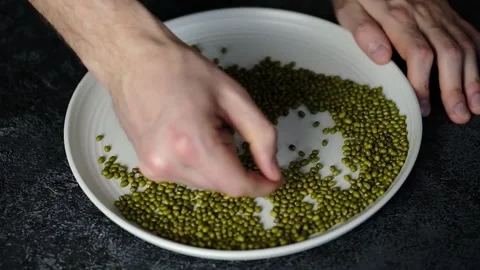 Man picking beans Stock Footage 170685476