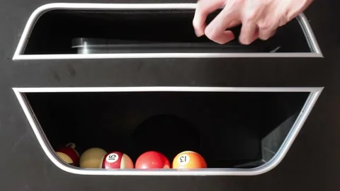 Man picking billiard ball from table Stock Footage 229606114