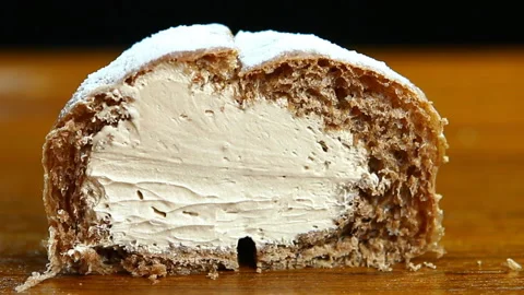 Man picking  bread by fork  on board, in studio Chiangmai Thailand Stock Footage 147429124