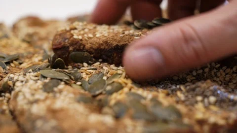 Man picking up a cereal bar. Stock Footage 89496780