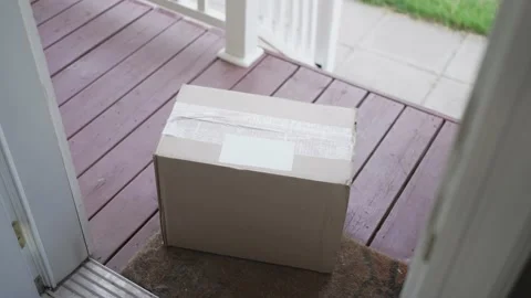 Man Picking up Delivered Packages Box Left at His Front Door Stock Footage 195590607