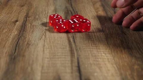 Man picking up dices Stock Footage 160917350