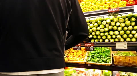 Man Picking Fresh vegetables and fruits at a farmer's market 4K Stock Footage 56324436