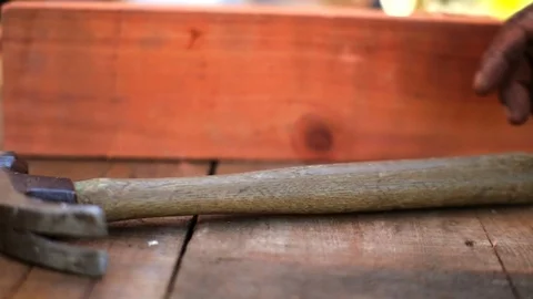 Man picking up hammer 库存影片 88404836