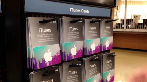 Man picking the itunes gift card Stock Footage 51637627