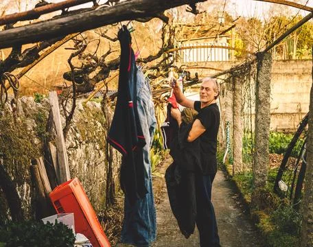 Man picking up the laundry Stock Photos