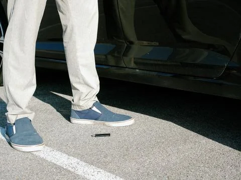 Man Picking Up Lost USB Flash Drive in Park Area Stock Photos