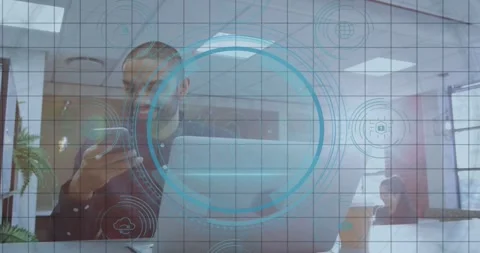 Man picking up phone after DATA PROTECTION appearing scanning laptop for Stock Footage 333965824
