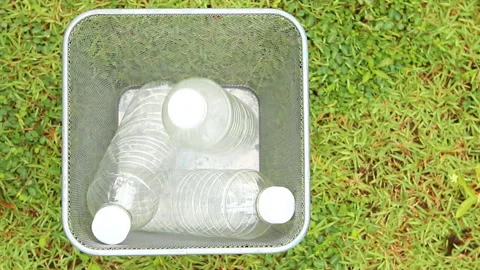 Man picking plastic water bottles from the bin out door  Chiangmai Thailand. Stock Footage 156993878