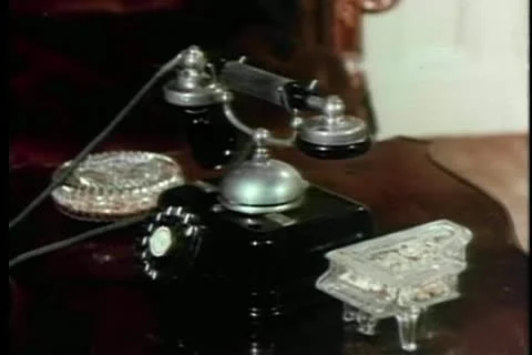 Man picking up receiver of old-fashioned telephone Stock Footage 11366411