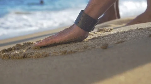 Man picking up sand in slow motion 動画素材 128074507