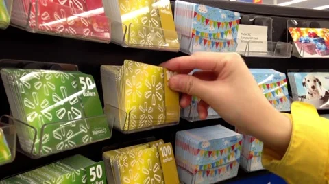 Man picking the Walmart gift card Stock Footage 48002748