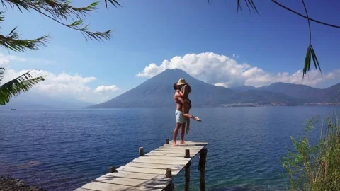 Man Picking Up Woman Into His Arms Stand 