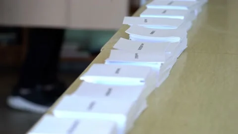 Man Picks Candidate Name to Vote For During French Presidential Election Stock Footage 178952382