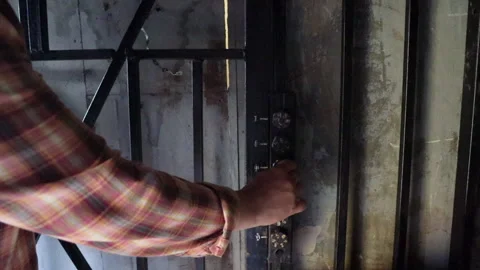 A man picks up the code to the safe Stock Footage 277019415