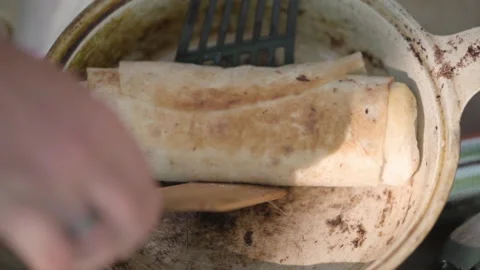 Man picks up the cooked shawarma from the pan. Stock Footage 142190331