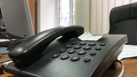 Man picks up the phone in office Video stock 106575307