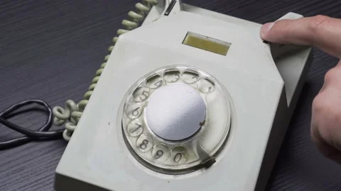 Man picks up receiver and clicks on reset to wait for a dial tone. Video stock 161606110
