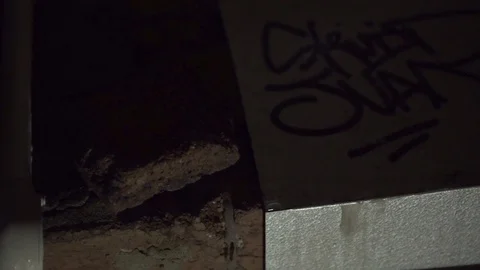 Man Picks Up Rock with intent to smash something Stock Footage 101214096