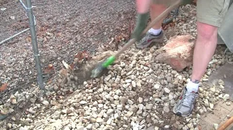 Man picks  rocks Stock Footage 10845142