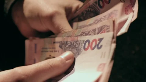 The man picks up a stack of banknotes Stock Footage 284443725