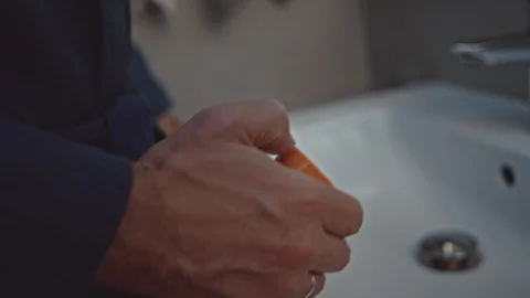 Man with pill bottle in bathroom Stock-Footage 107650845