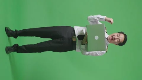 Man Pilot Looking At A Laptop Then Screaming Goal Celebrating ON Green Screen Stock Footage 244400631