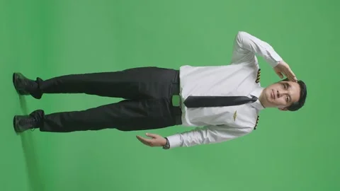 Man Pilot Is Respectful, Saluting While Standing In The Green Screen Background Stock Footage 244401129