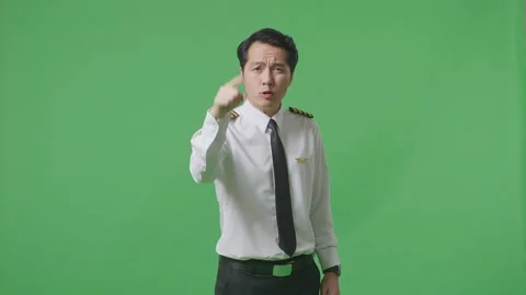 Man Pilot Shouting To Camera While Standing In The Green Screen Background Stock Footage 244393531