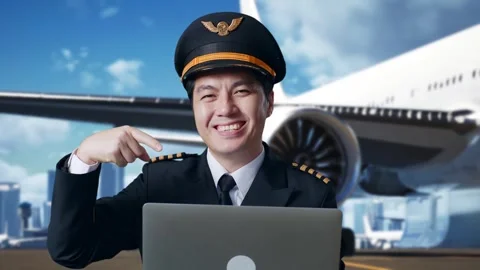 Man Pilot Smiling And Pointing To A Laptop In Airfield With Airplane Stock Footage 267516693