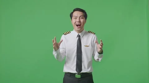 Man Pilot Smiling And Saying Wow While Standing In The Green Screen Background Stock Footage 244393383