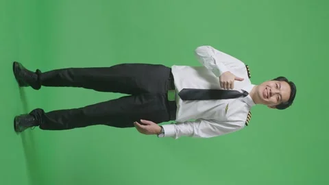 Man Pilot Smiling And Showing Thumbs Up Gesture To Camera Standing Green Screen Stock Footage 244398849