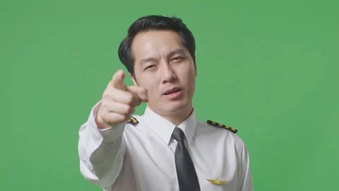Man Pilot Smiling And Touching His Chest Then Pointing At You On Green Screen Stock Footage 244396607
